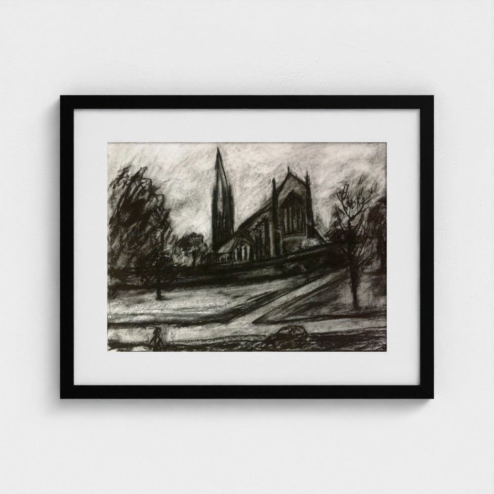 Black-framed Surrey urban landscape print by Colin Galloway, showing a church and tall spire in black and white.
