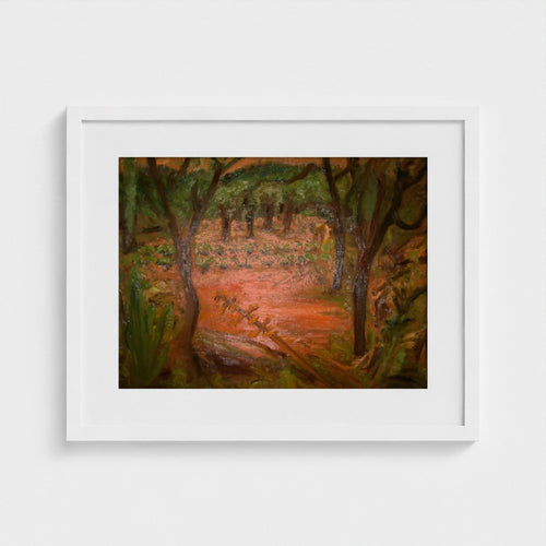 White-framed print of Colin Galloway’s Santa Ines evening landscape, with dark trees and warm orange earth.
