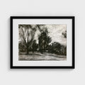 Black-framed Surrey landscape print by Colin Galloway, with dark trees and pale sky in black and white.