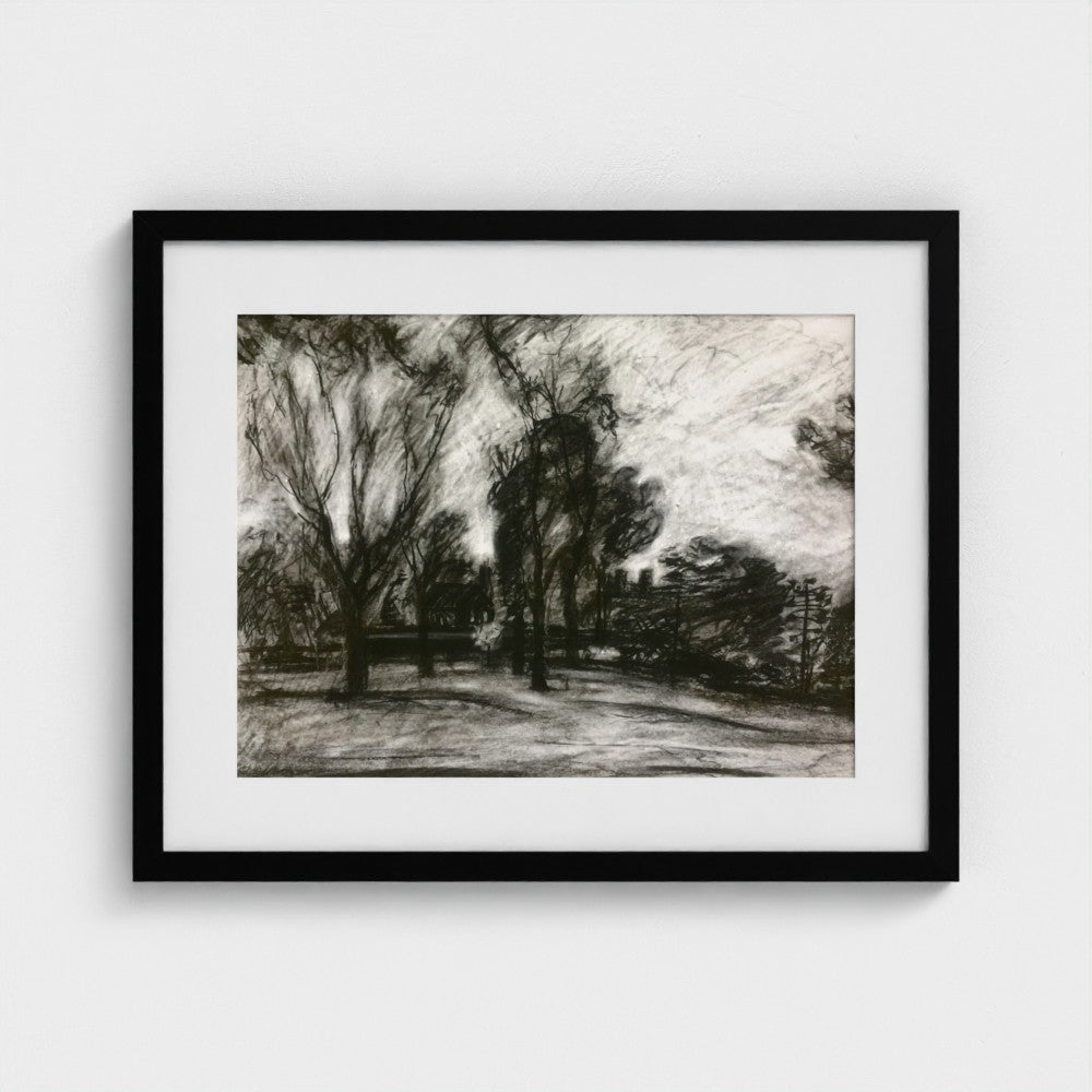 Black-framed Surrey landscape print by Colin Galloway, with dark trees and pale sky in black and white.